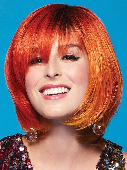 The Fierce Fire Wig by Hairdo embraces your fierceness in shades of flaming orange